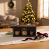 Mee kinkekomplekt „Estonia” 3 × 50 g jõuluhõngulisel kinkefotol.