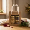 Blossom honey 430 g, mint-raspberry tea 12 g and coconut balls 110 g in a natural gift box with handles in a warm Christmas gifting setting.