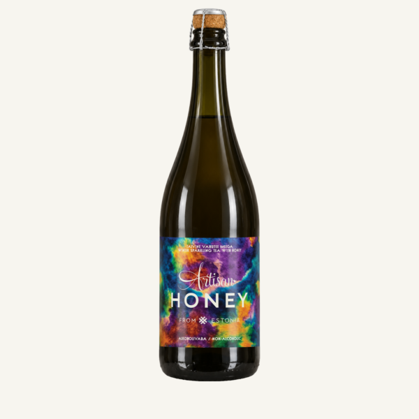 Artisan Honey talvine vahutee meega 750 ml, uue värvilise etiketiga pudel soojal heledal taustal